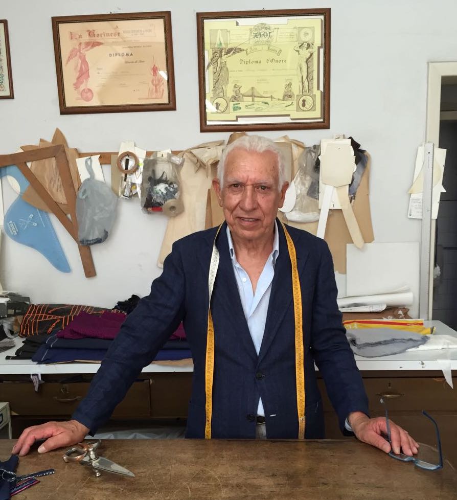 Sicilian tailor Arrigo at his cutting table. Photo credit: Juhn Maing