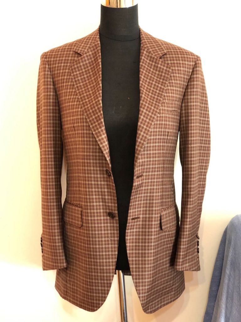 Final fitting by tailor Laterra in his workshop. Photo credit: Juhn Maing.